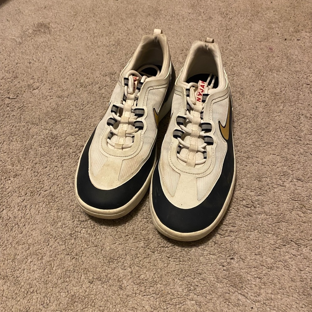 Nike Cream and Black Sneakers with Gold Accents
